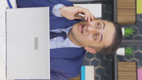 Vertical-video-of-Businessman-getting-good-news-on-the-phone.